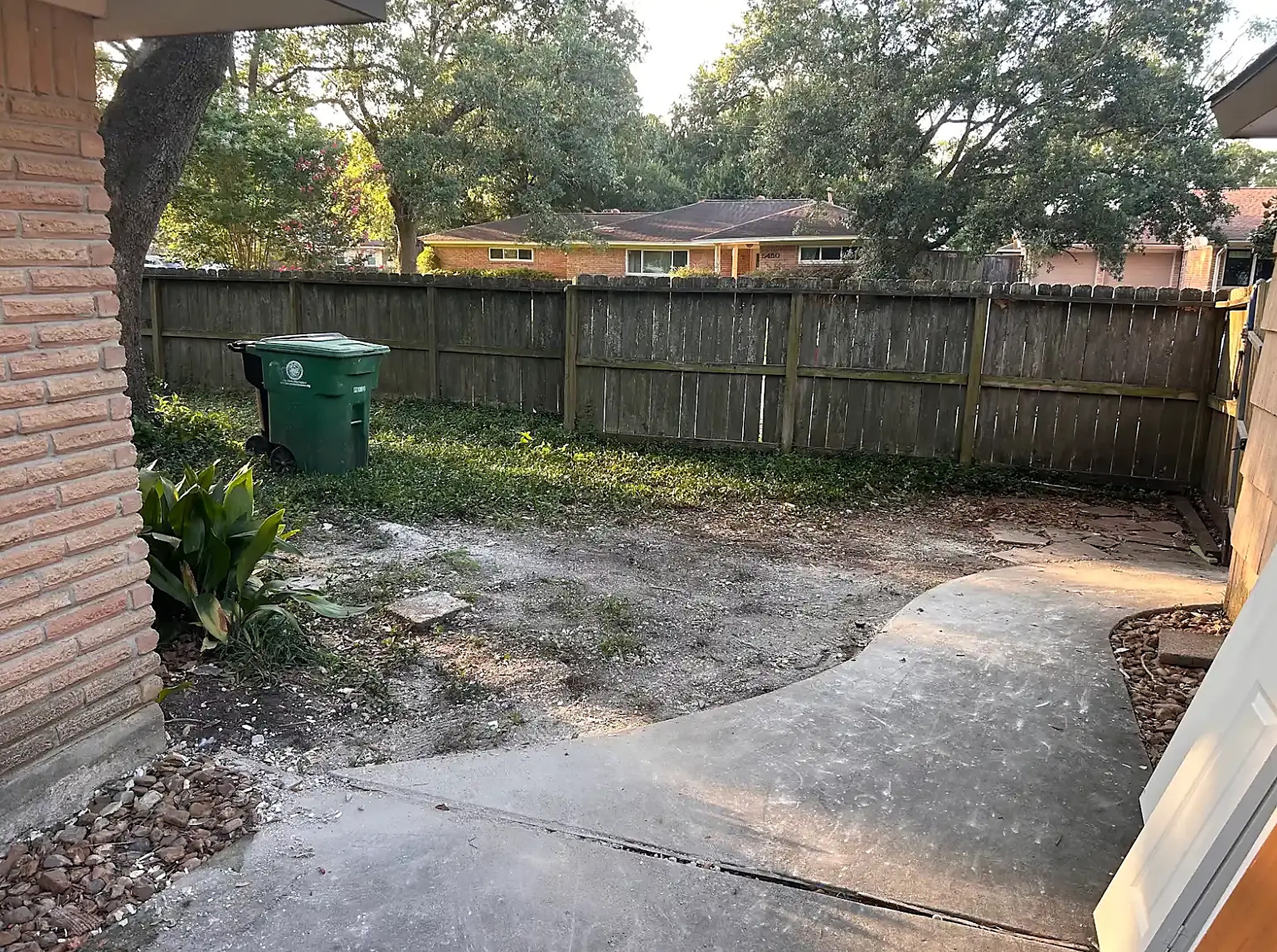 Cleared side yard and driveway after Prestige Junk Removal cleared the remodel debris pile