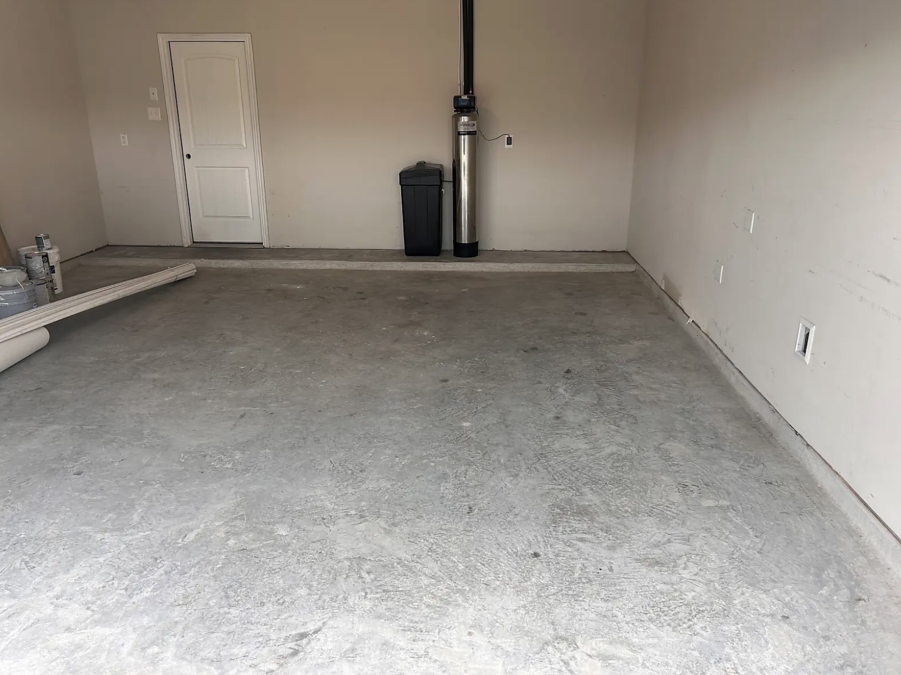 The same Houston garage completely emptied and swept clean after Prestige Junk Removal hauled the debris away